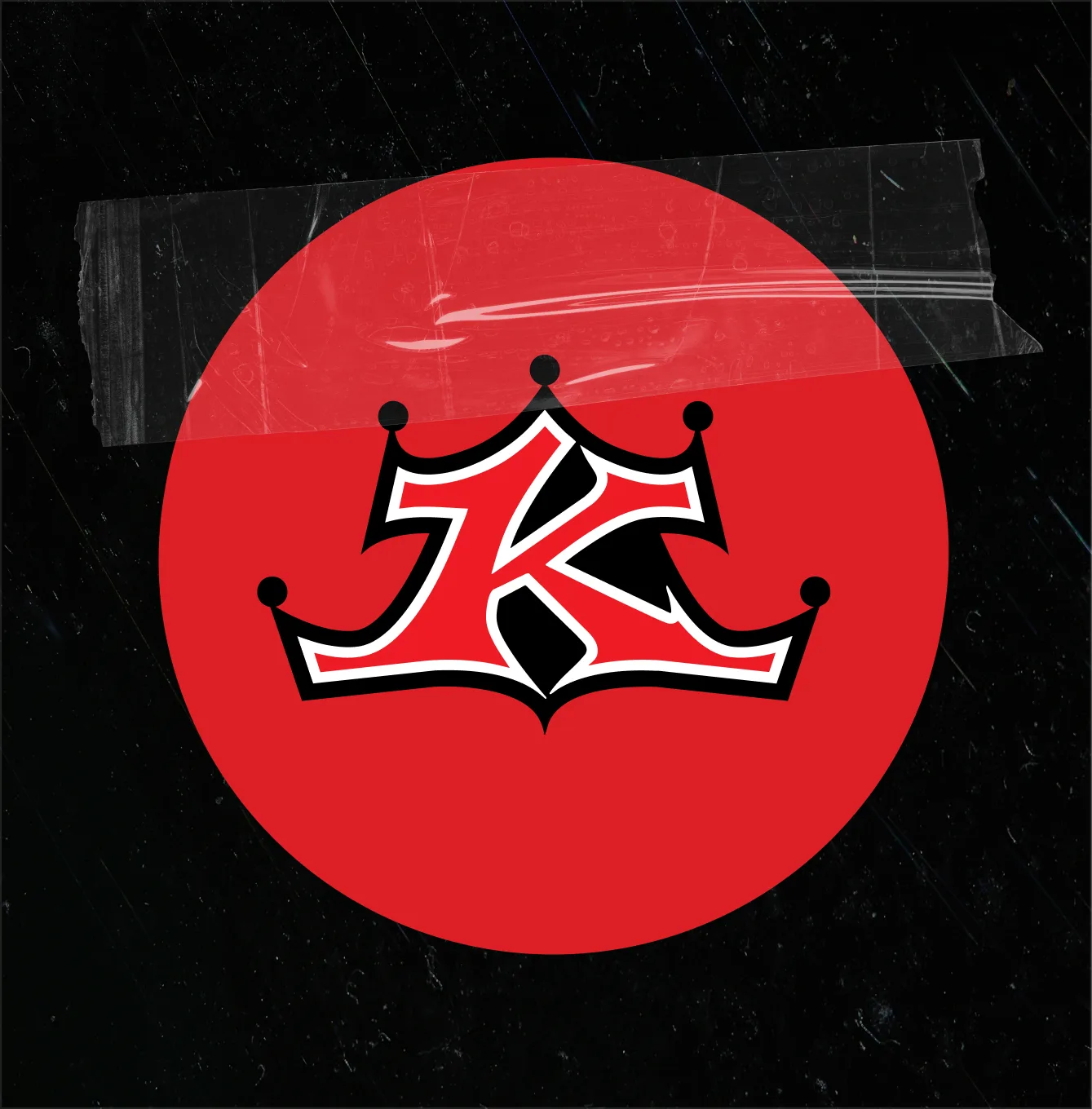 The crown K badge in a red circle under studio tape