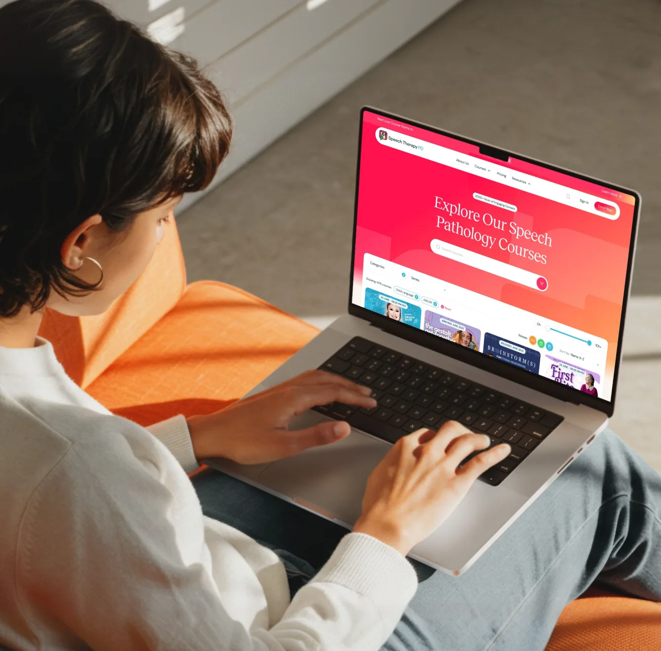 Person browsing the Speech Therapy PD course catalog on a laptop